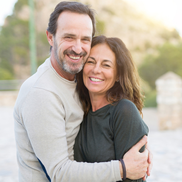 Extractions Middle Aged Couple Hugging Outdoors