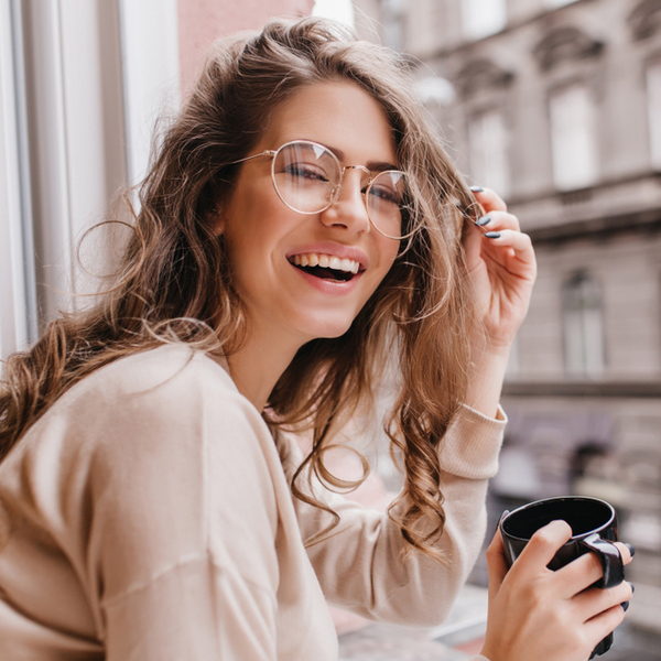 Bridges Young Woman with Coffee in Front of Window