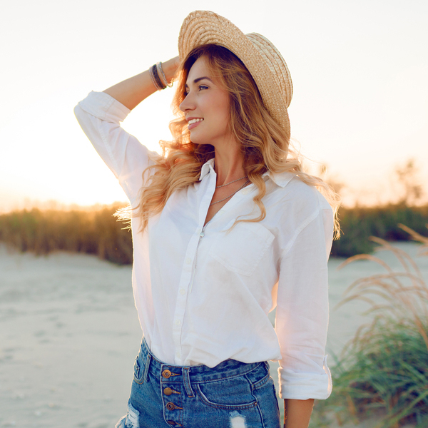 Cleanings Young Woman Outdoors on a Beach