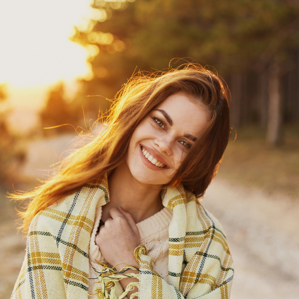 Dental Implants Young Woman with Blanket Outdoors