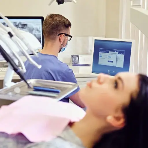 attractivebrunettefemaledentistchairstomatologyroom768×512